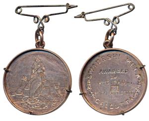 Swadeshi Mela, Engraved Gold Medal, 10.6g, obv. Godess Laxmi seated holding a water pot an