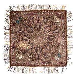 Depicting a lotus medallion with figures enclosed in a register of cusped lozenge shaped m