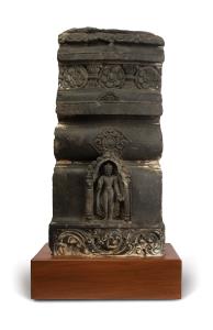 The tiered drum section with central standing figure of Buddha within an arched niche flan