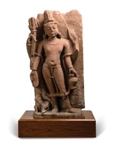 The four-armed god standing in tribhanga, his primary right hand in varada mudra, his left