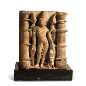 Standing in tribhanga between a pair of columns, a kamandal (water vessel) in his lower le