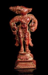 The boar-headed avatar of Vishnu standing on a lotus base on raised square plinth, holding