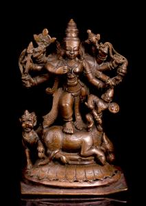 The eight-armed goddess on a domed lotus,her lion at her side, holding various weapons and