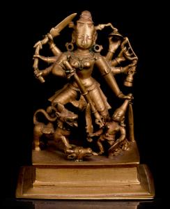 The eight-armed goddess on a domed lotus, her lion at her side, holding various weapons an