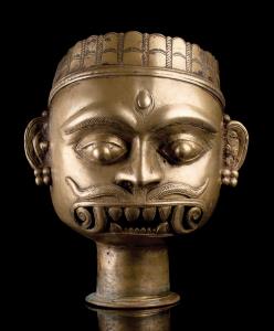 The head with slender cylindrical neck to be mounted on a pole for processional use. Cast 