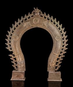 Of horseshoe-shaped form, fringed with stylised flame motifs, the front decorated in relie