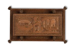 Raised on lion supports standing on rectangular base with brass claw feet, the relief carv