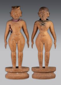 The male and female nude figures each standing erect on a segment shaped lotus base, the f