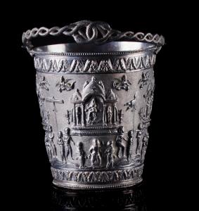 The sides decorated with a continuous frieze depicting a series of shrines containing Hind