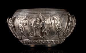 Of compressed spherical form, with folded-in rim, the sides with a series of cartouches wi