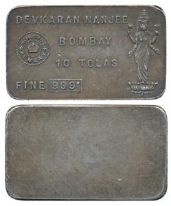 Devkaran Nanjee, Silver 10 Tolas Bar, 116.68g, obv. name and logo of the company represent