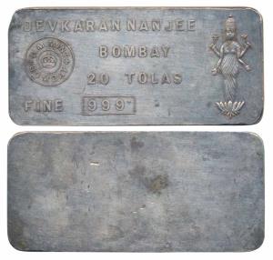 Devkaran Nanjee, Silver 20 Tolas Bar, 232.8g, obv. name and logo of the company represente
