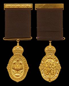 Kaiser-i-Hind Medal, George V, Gold 59g (including the ribbon), an oval badge surmounted b